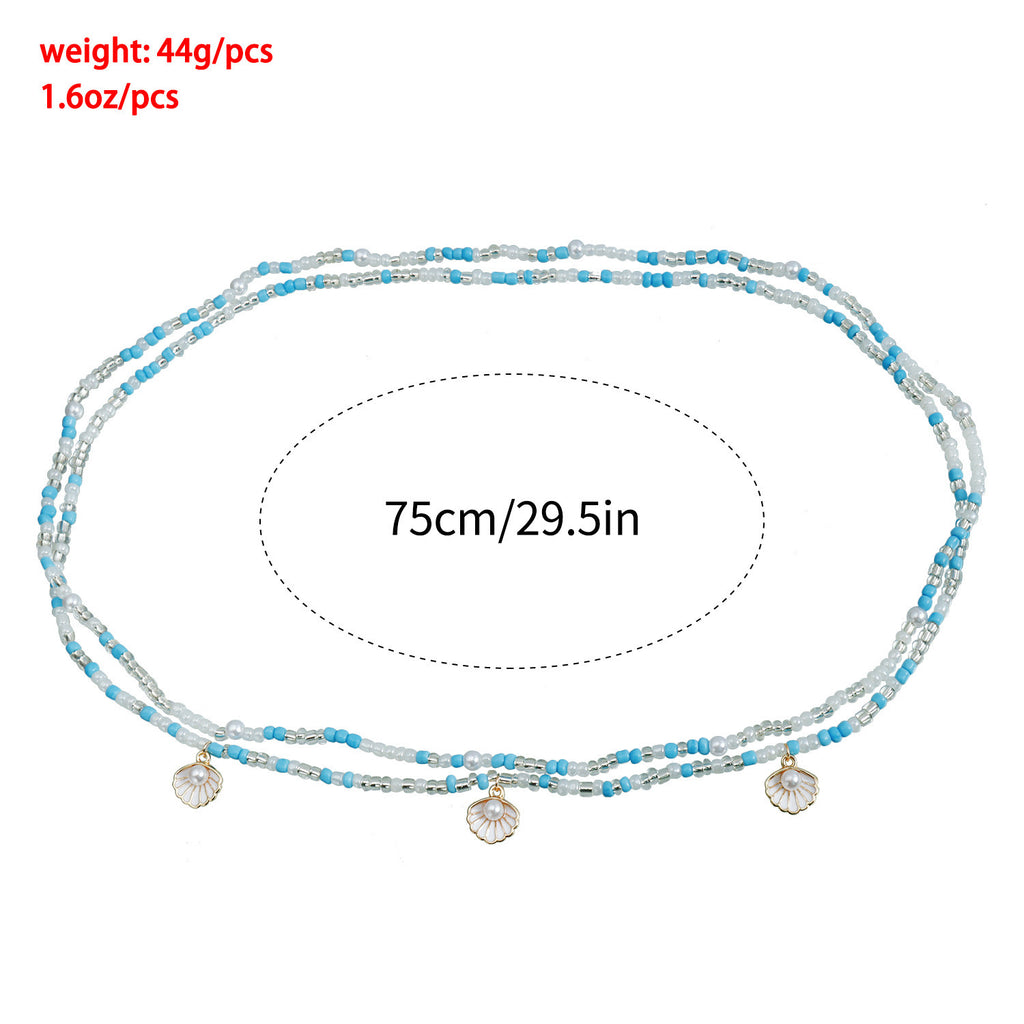 Chaîne de taille Baya Océan – longueur 75 cm, perles bleues et blanches avec coquillages perlés
