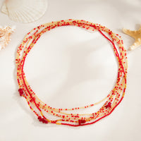 Chaîne de taille Baya Flamboyant – chaînes de perles rouge orangé et dorées